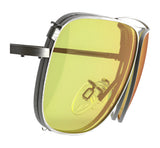 A close-up of RE Ranger Sporter Clip-On Lens glasses featuring yellow-tinted lenses, metal frames, a nose pad, and precision lens technology.
