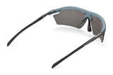 Rudy Project Rydon Sunglasses by Rudy Project shown from the rear, feature blue frames, dark lenses, and black arms on a white background. Adjustable anti-slip nosepads ensure comfort during intense activities.