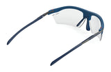 Rudy Project Rydon Sunglasses by Rudy Project shown from the rear on a white background, featuring blue frames, clear lenses, and adjustable anti-slip nosepads for enhanced comfort.