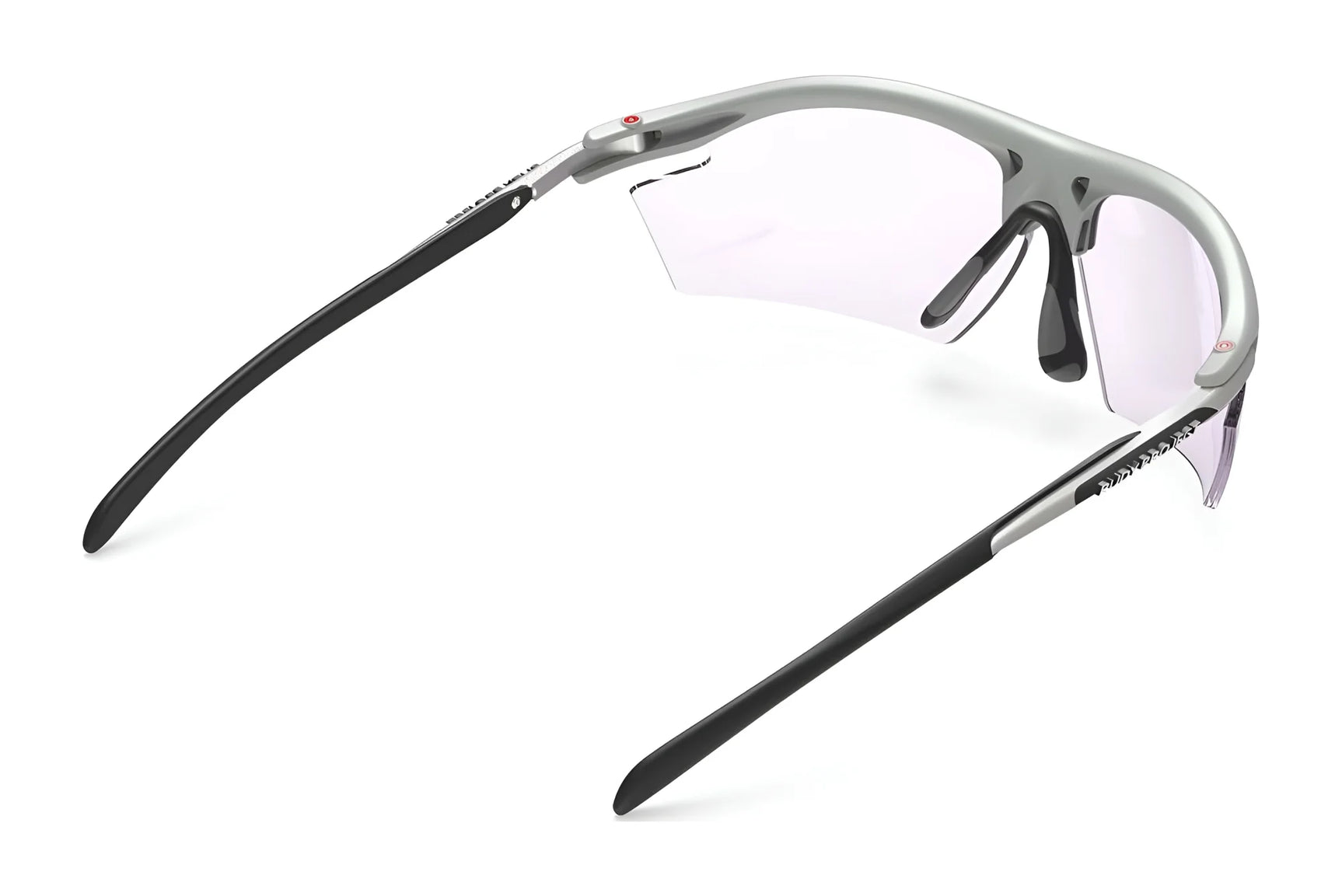 Rudy Project Rydon Sunglasses by Rudy Project shown from the back at an angle on a white background, featuring a silver and black frame, clear lenses, and adjustable anti-slip nosepads.
